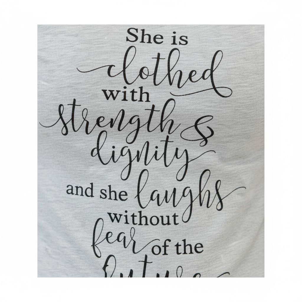 Close-up heather gray women's graphic T-shirt with faith verse lettering.