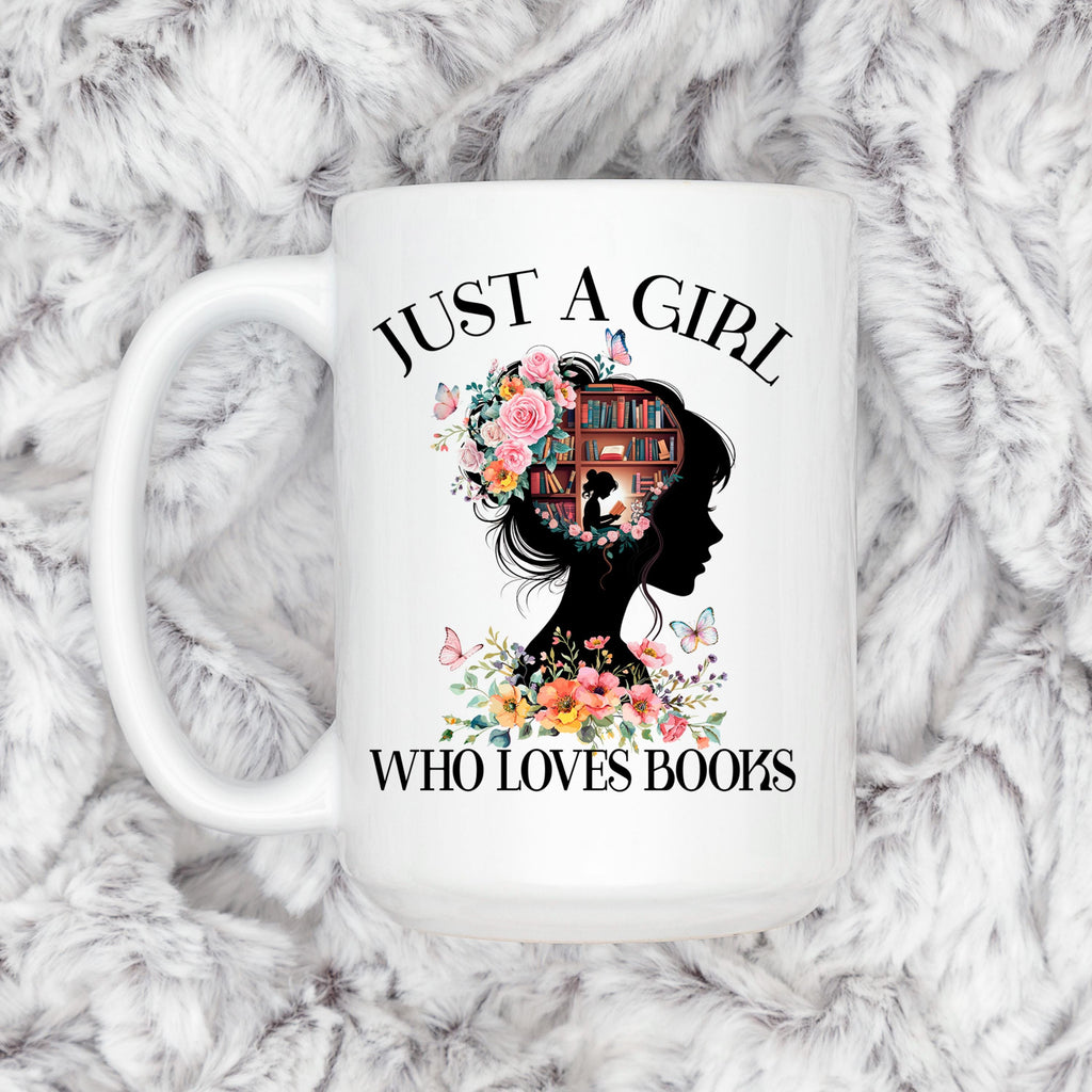 White ceramic coffee mug featuring floral book silhouette and “WHO LOVES BOOKS” text.