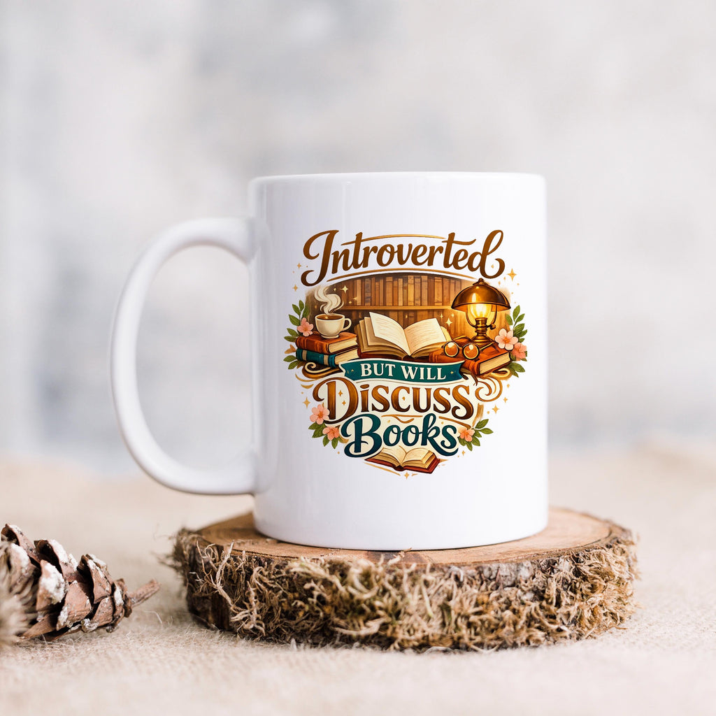 White ceramic mug, front-facing, with colorful "Introverted, but will discuss books" quote