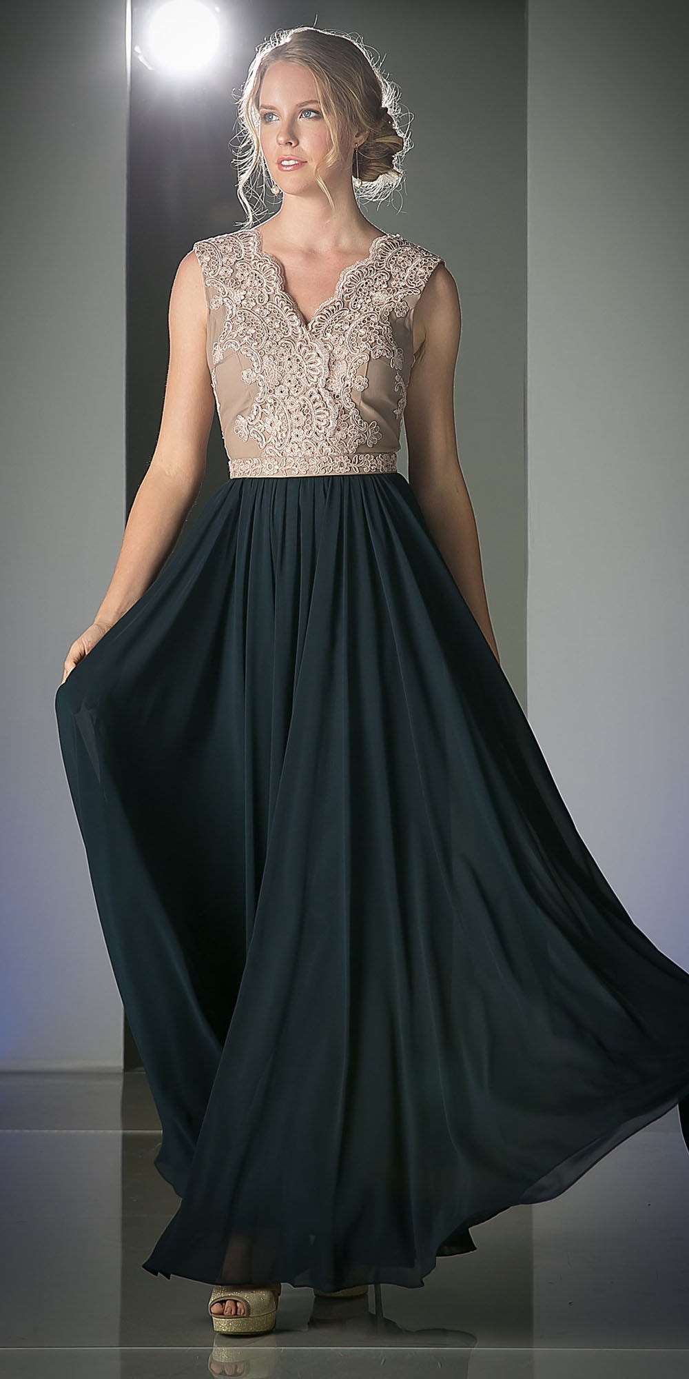 Sleeveless V-neck dress with embroidered lace bodice and dark teal gathered skirt