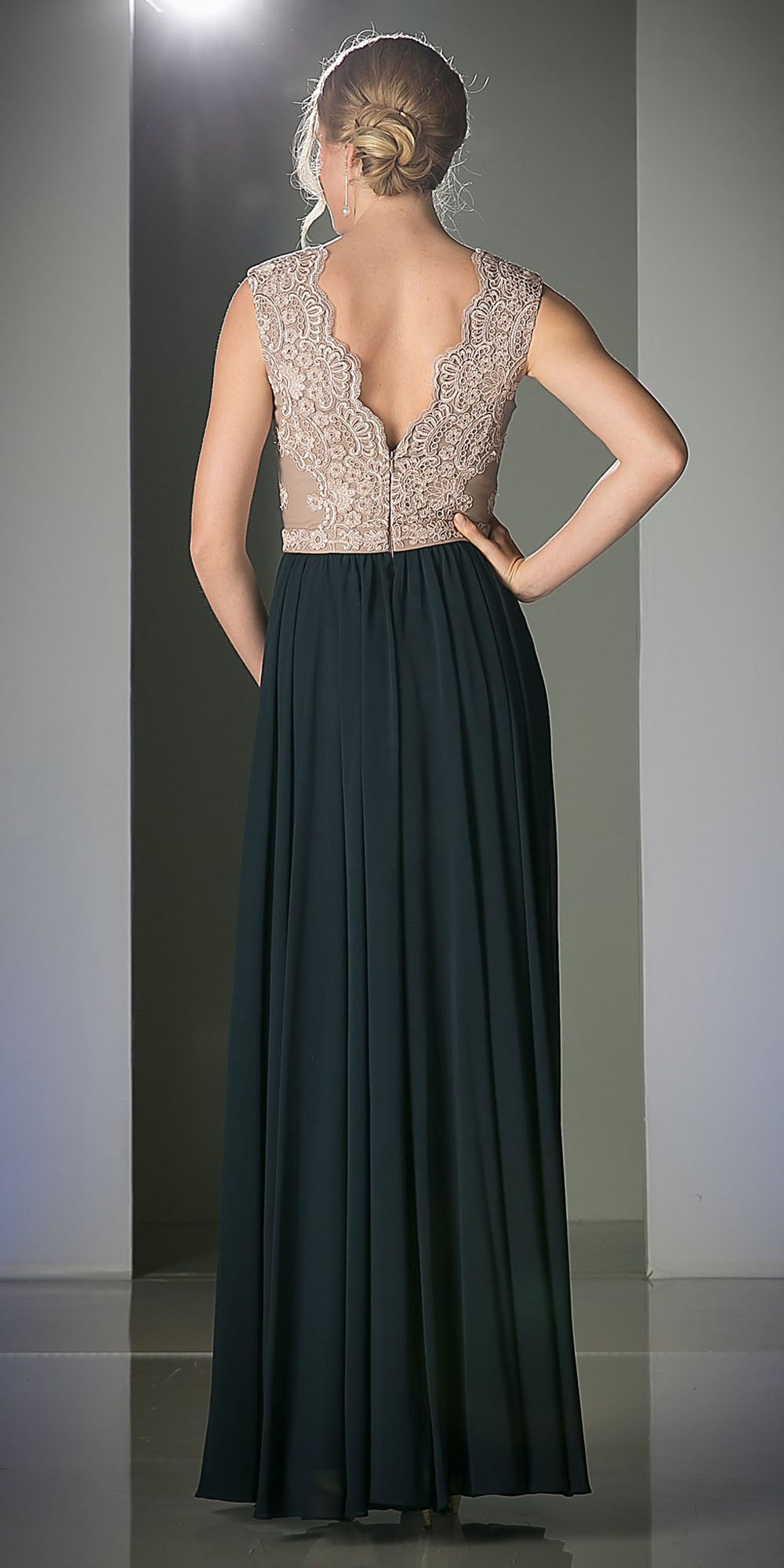 Sleeveless V-neck dress with embroidered lace back and dark teal gathered skirt