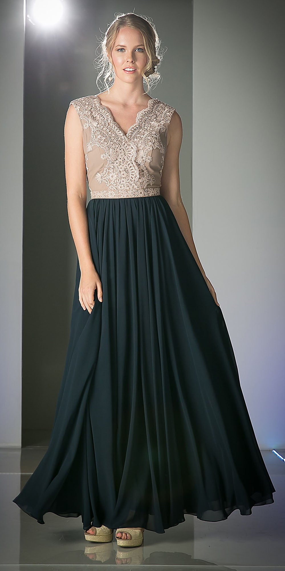 Sleeveless V-neck dress with embroidered lace bodice and flowing dark teal skirt