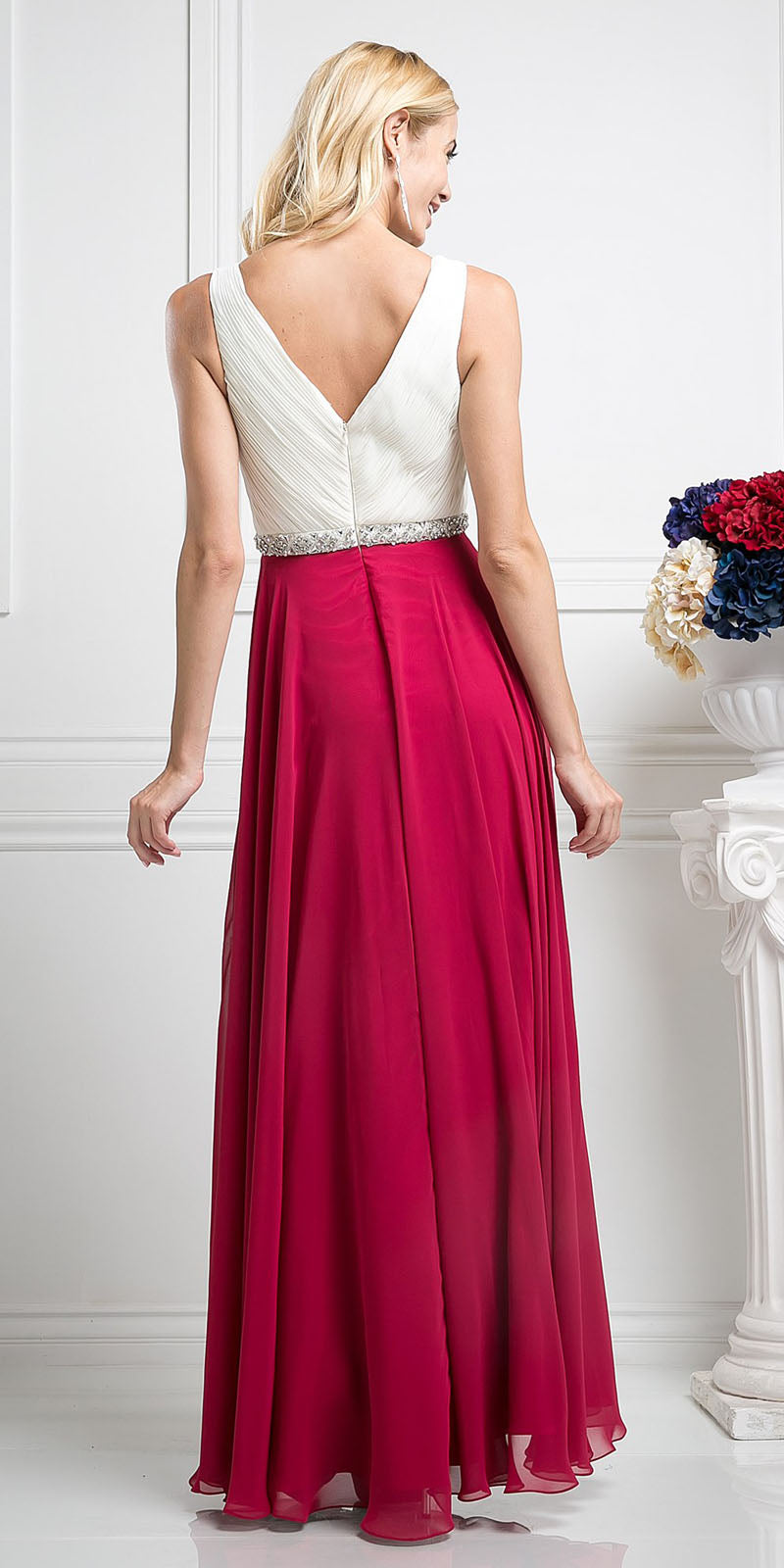 Sleeveless A-line dress with V-back bodice and pleated burgundy skirt