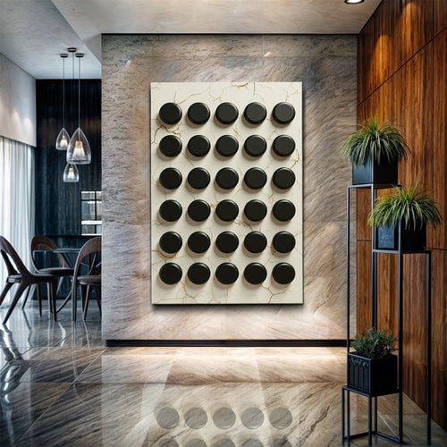 Abstract minimalist wall art showing a grid of raised black circles on cream marble