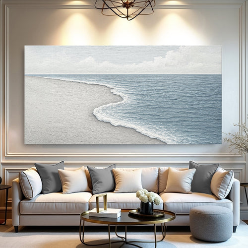 Landscape canvas wall art of a textured beach shoreline with soft waves, blue water