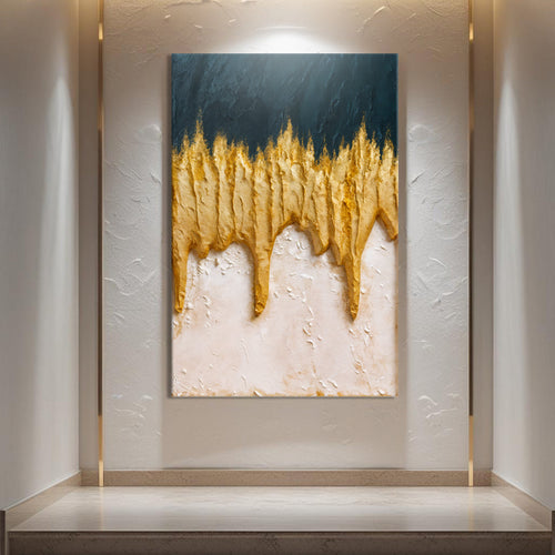 Abstract canvas wall art with dark blue top, gold drip streaks, and white textured base