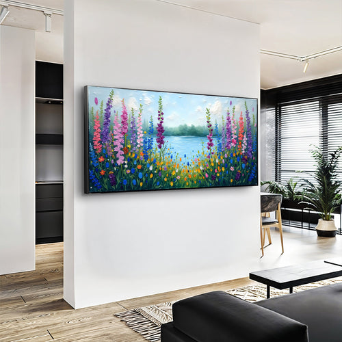 Framed wildflower lake landscape wall art displayed on a white wall