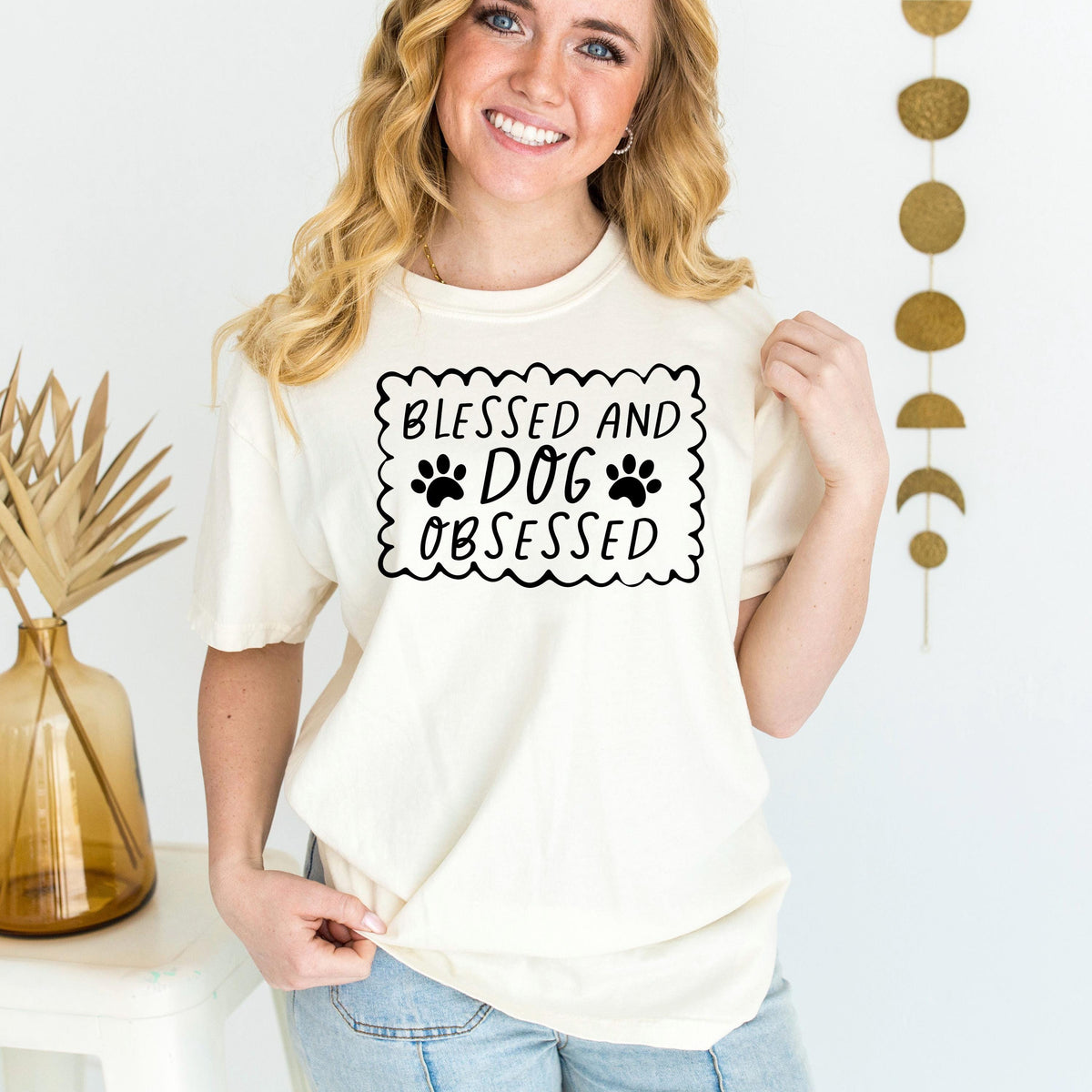Cream short-sleeve T-shirt with “Blessed and Dog Obsessed” paw print graphic