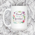 White coffee mug with floral wreath and “Friend, you are Beautiful” affirmation