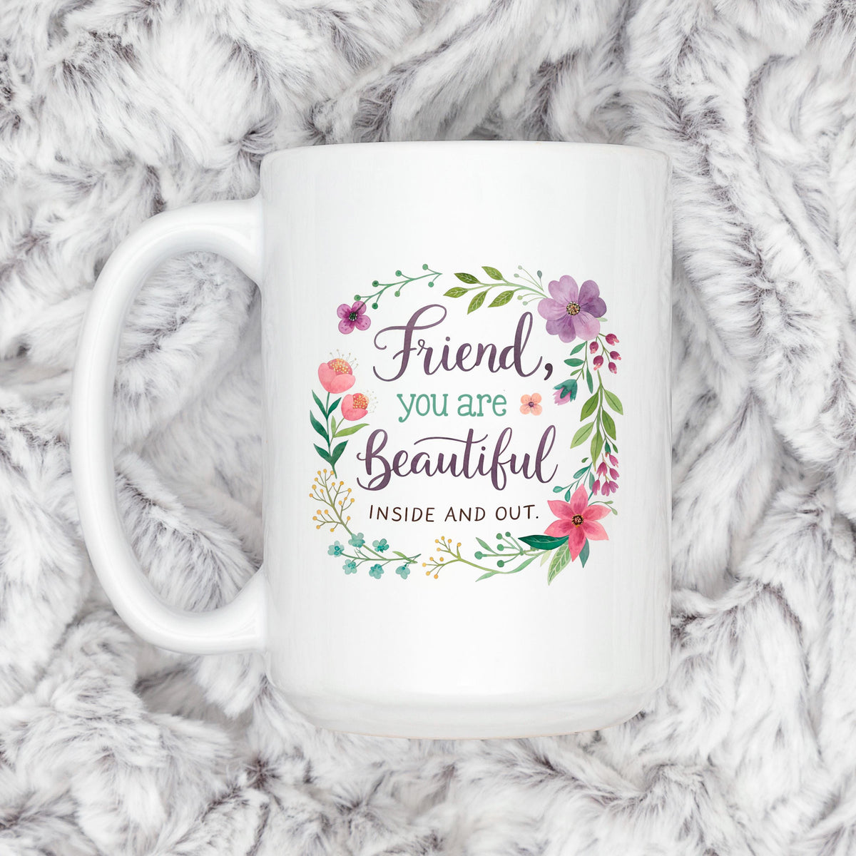 White coffee mug with floral wreath and “Friend, you are Beautiful” affirmation