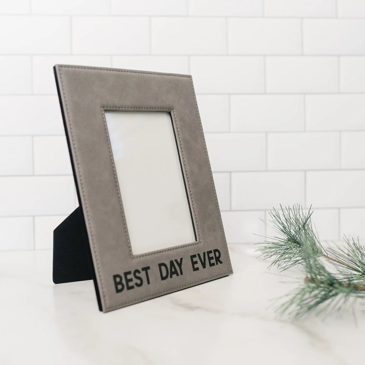 Gray faux-leather photo frame with easel back and “BEST DAY EVER” inscription