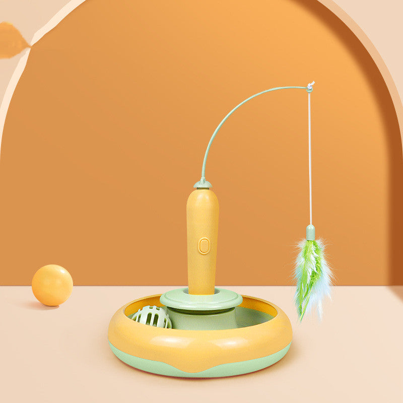 Self-play cat turntable toy with yellow wand and green feather, round spinning base.