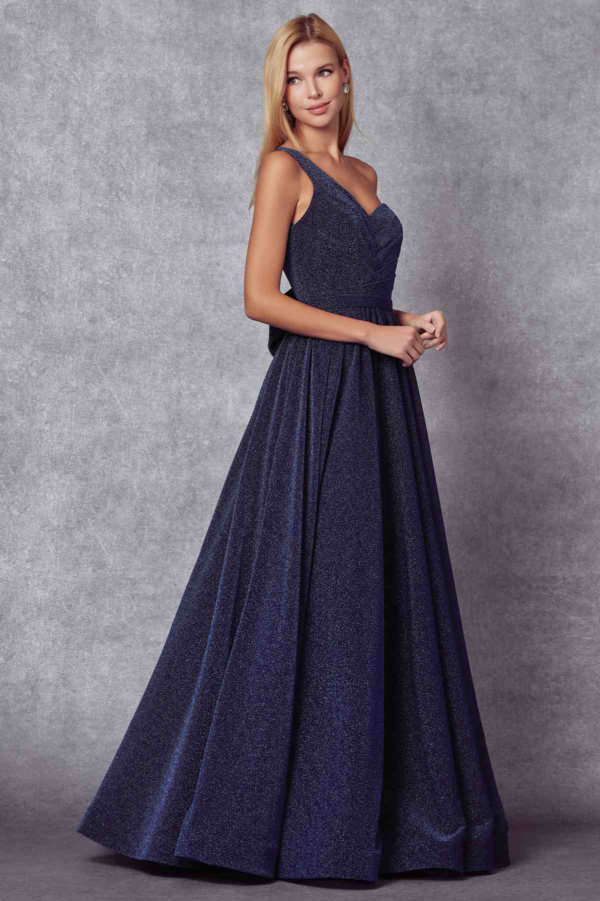Navy one-shoulder sleeveless glitter gown with gathered waist and long flowing skirt
