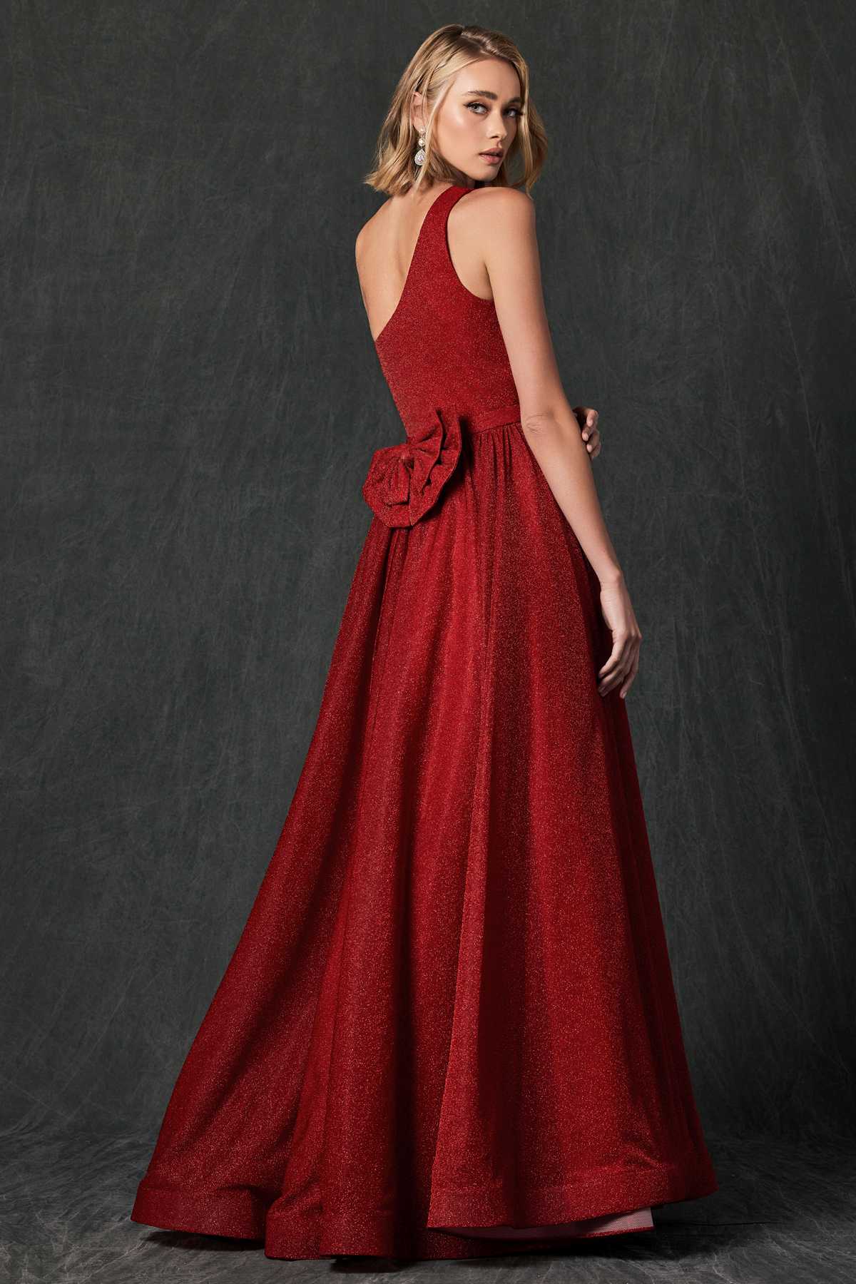 Red one-shoulder sleeveless glitter gown with draped waist and wide A-line skirt