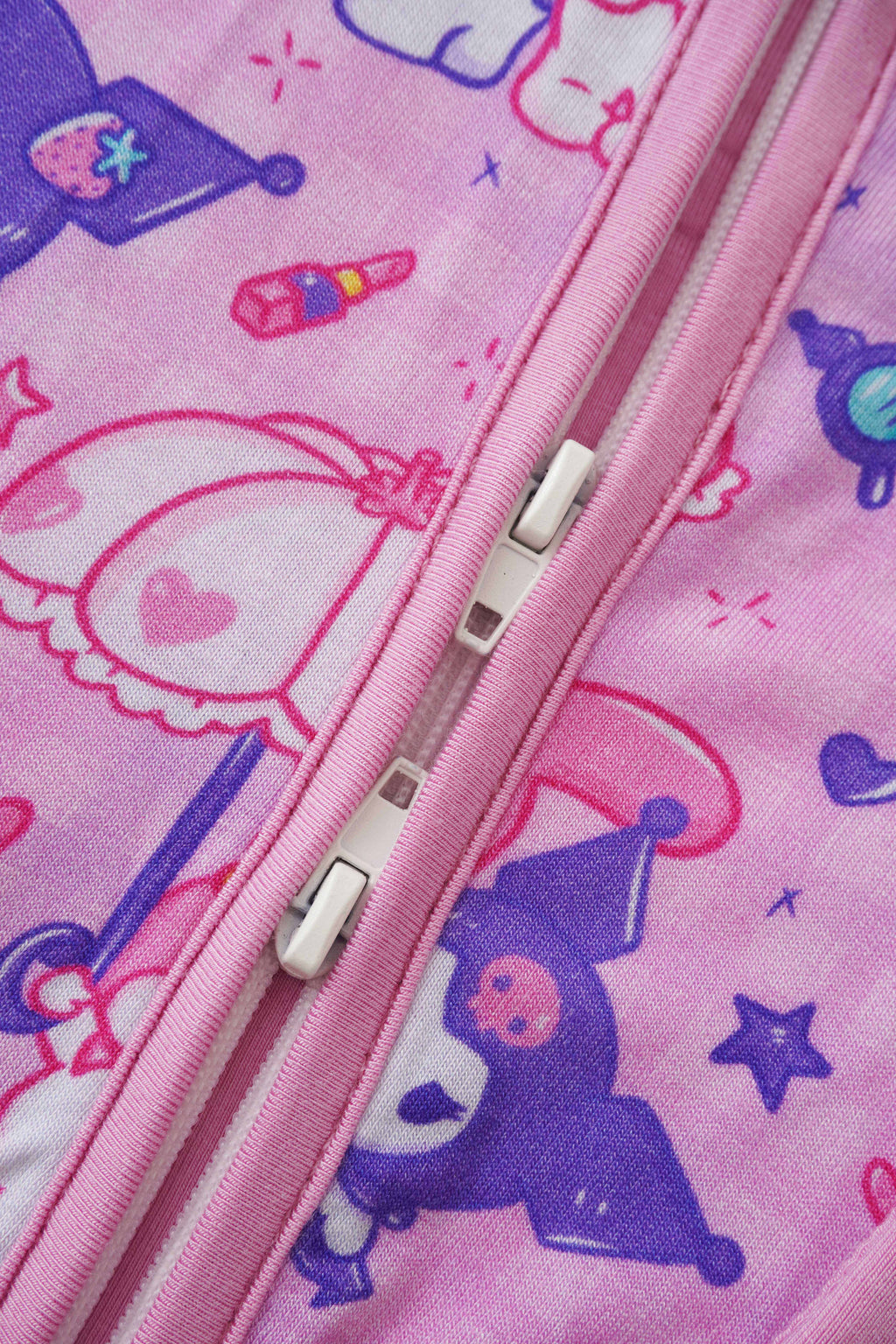 Pink bamboo baby romper zipper closeup with two pull tabs and character print