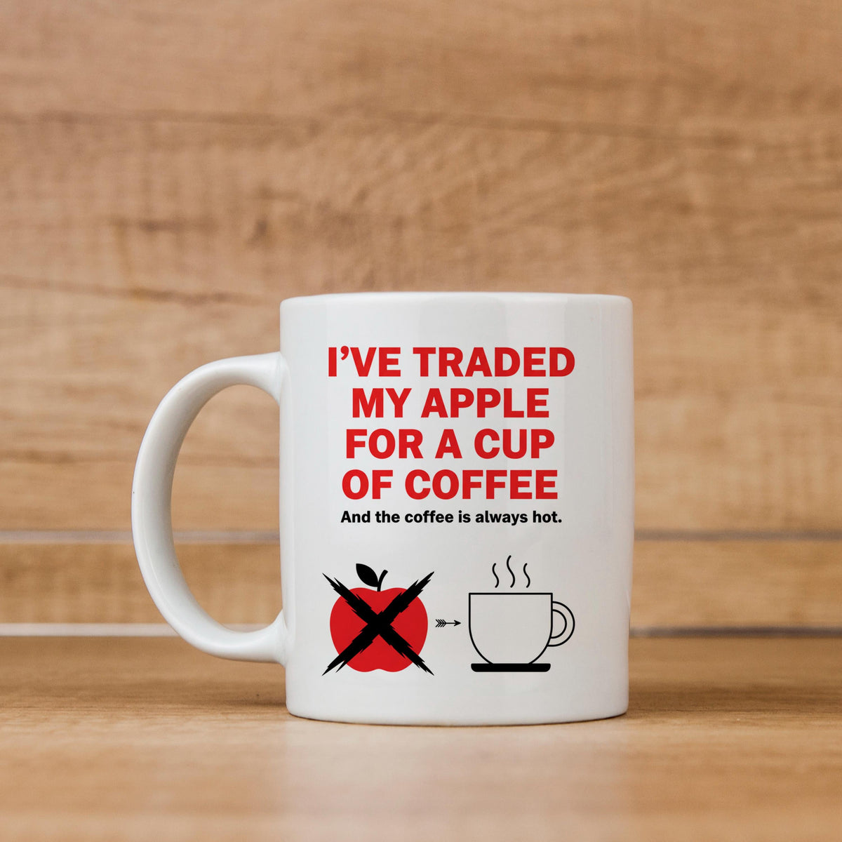 White ceramic mug with red 'I’ve traded my apple' coffee slogan and crossed apple icon