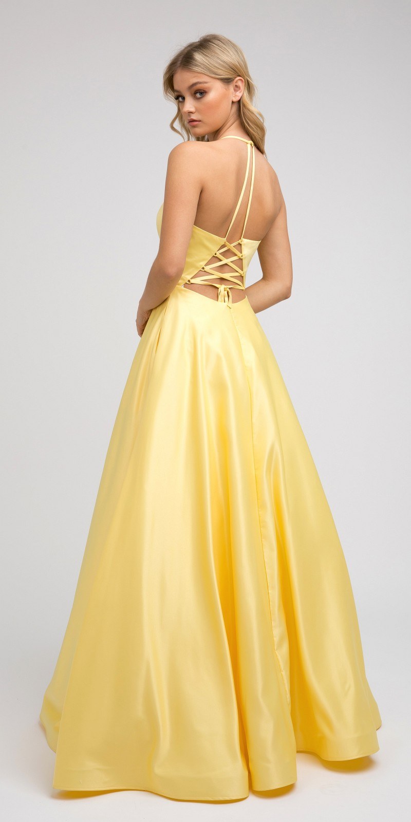 Satin A-line prom dress in pale yellow with lace-up open back and thin straps