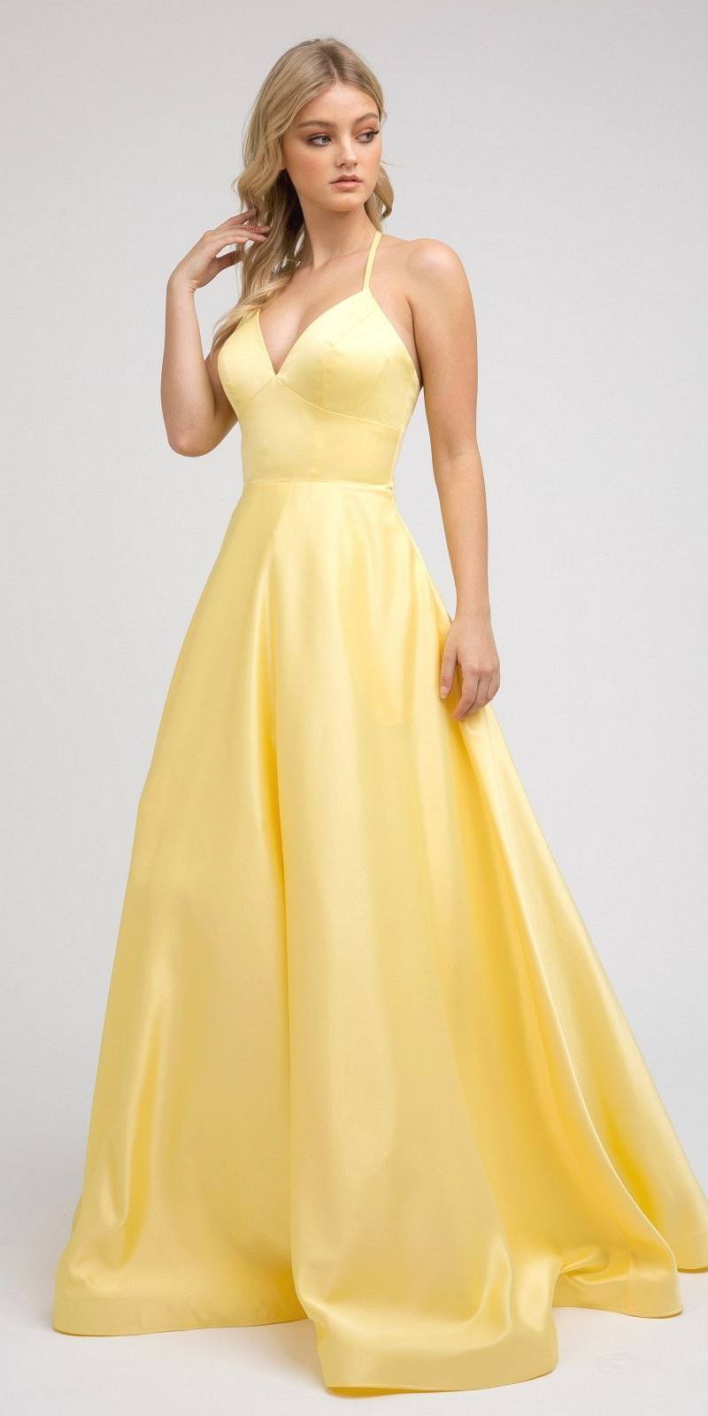 Satin A-line prom dress in pale yellow with spaghetti straps and flared full skirt