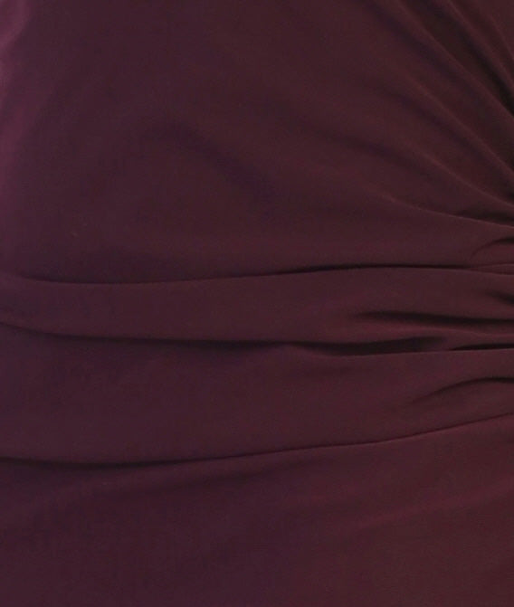 Dark knit fabric swatch with smooth draped folds