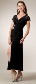 Black tea-length dress with lace cap sleeves and fitted ruched waist