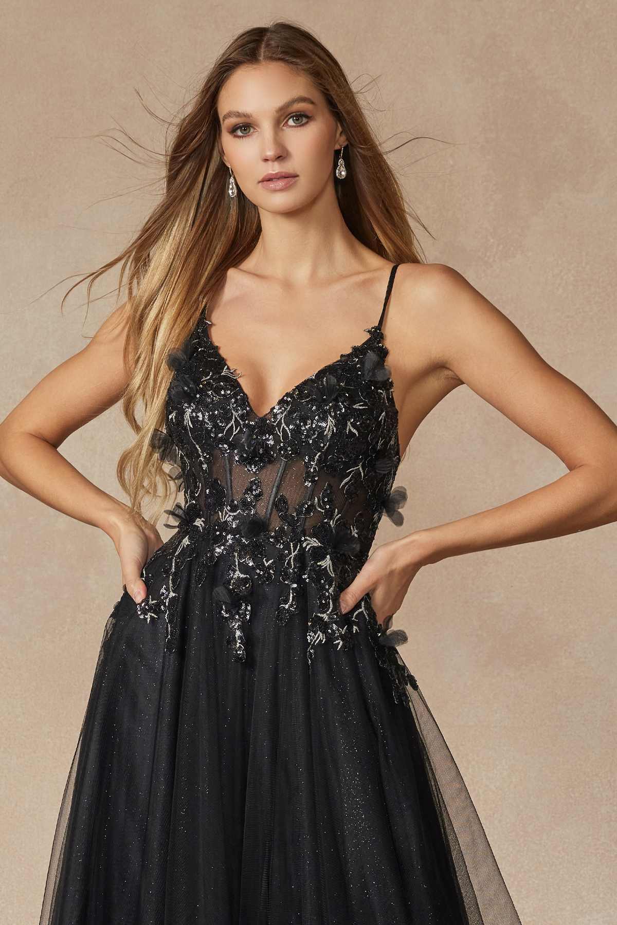 Black tulle A-line gown with thin straps and shimmering corset-style bodice