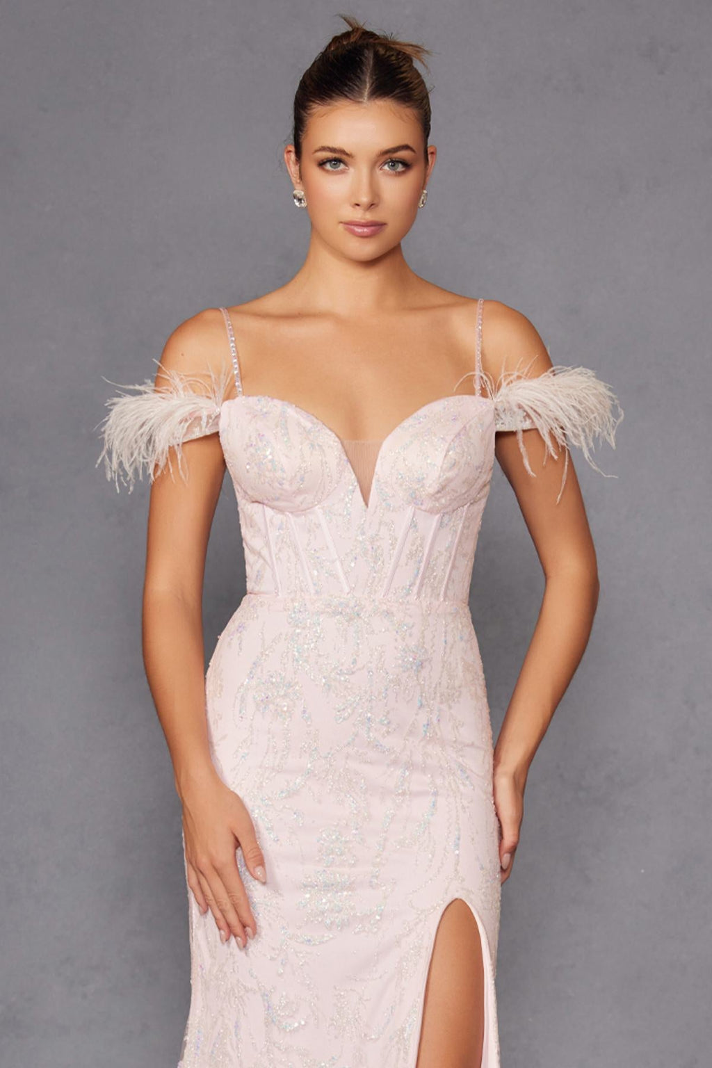 Off-white sequin gown with feathered off-shoulder sleeves, sweetheart neckline, slit