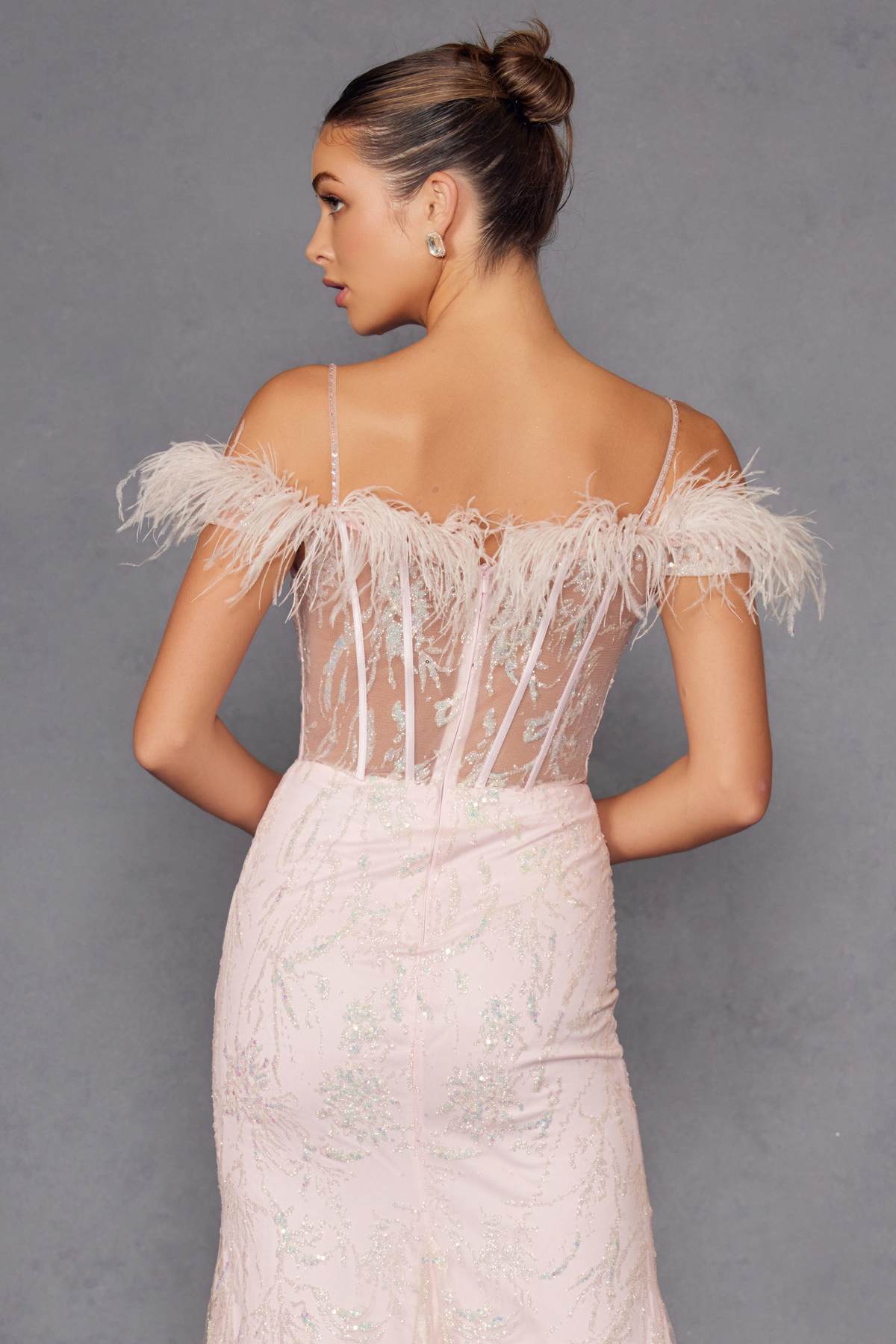 Off-white sequin gown with feathered off-shoulder straps and open back
