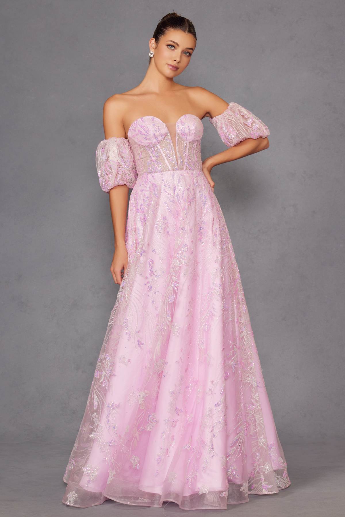 Light pink strapless sequin tulle ballgown with off-shoulder puff sleeves and flowing skirt