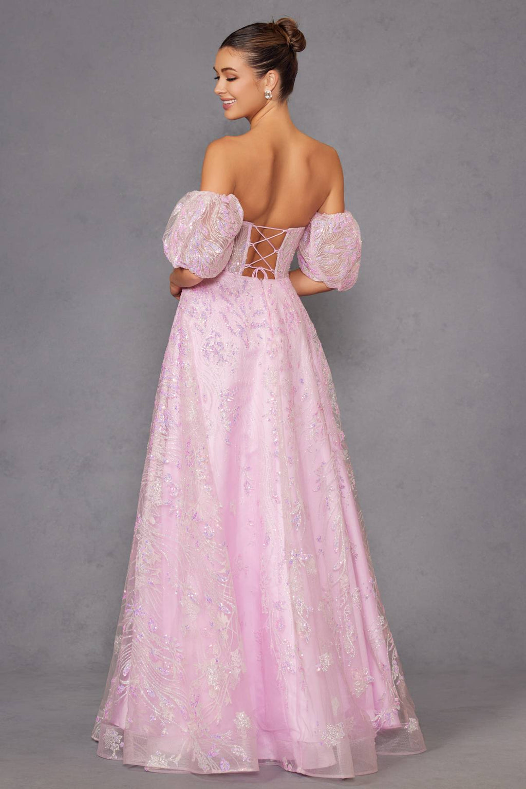Pink strapless sequin tulle ballgown back view with lace-up and puff sleeves