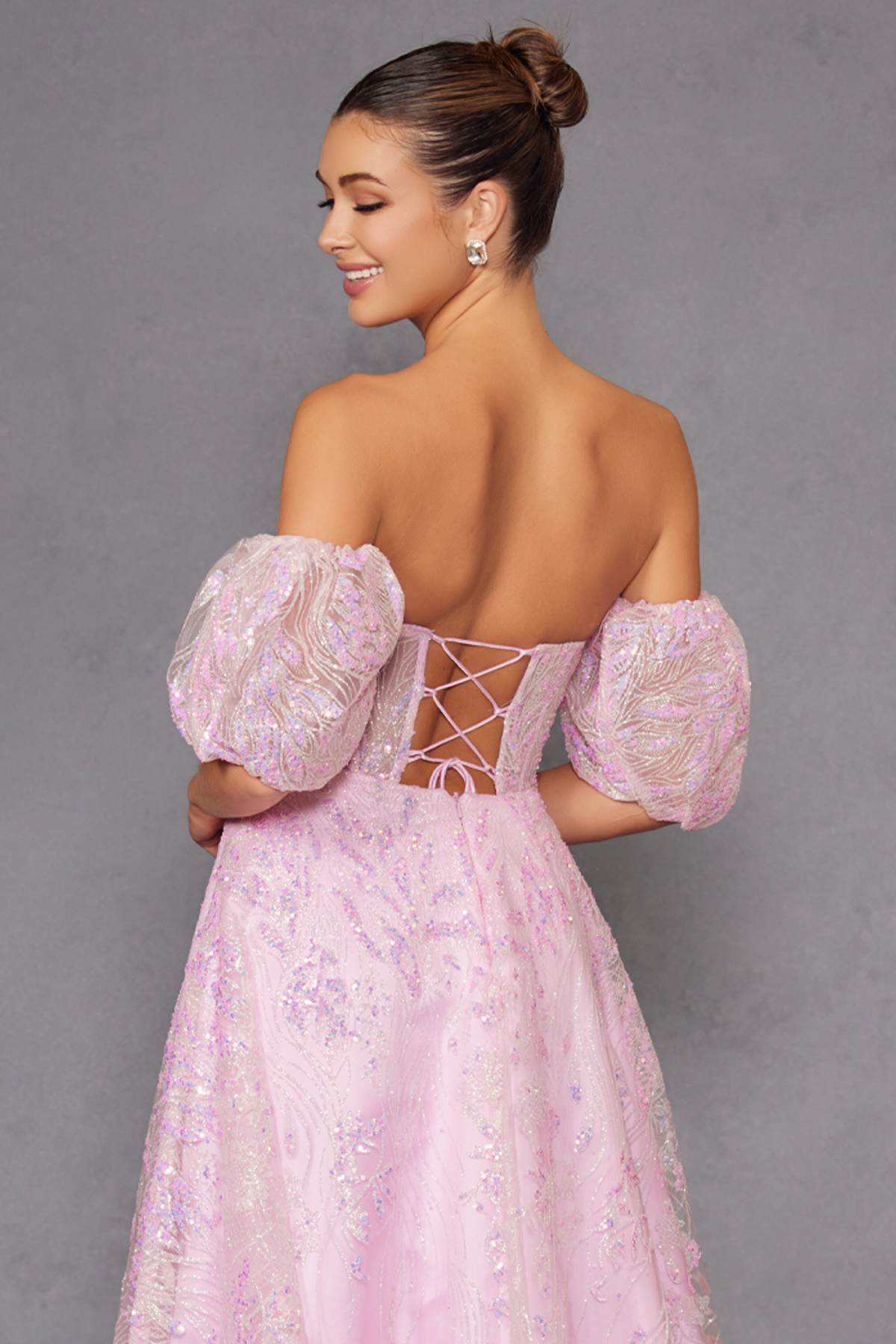 Pink strapless sequin tulle ballgown with back lace-up and puff sleeves