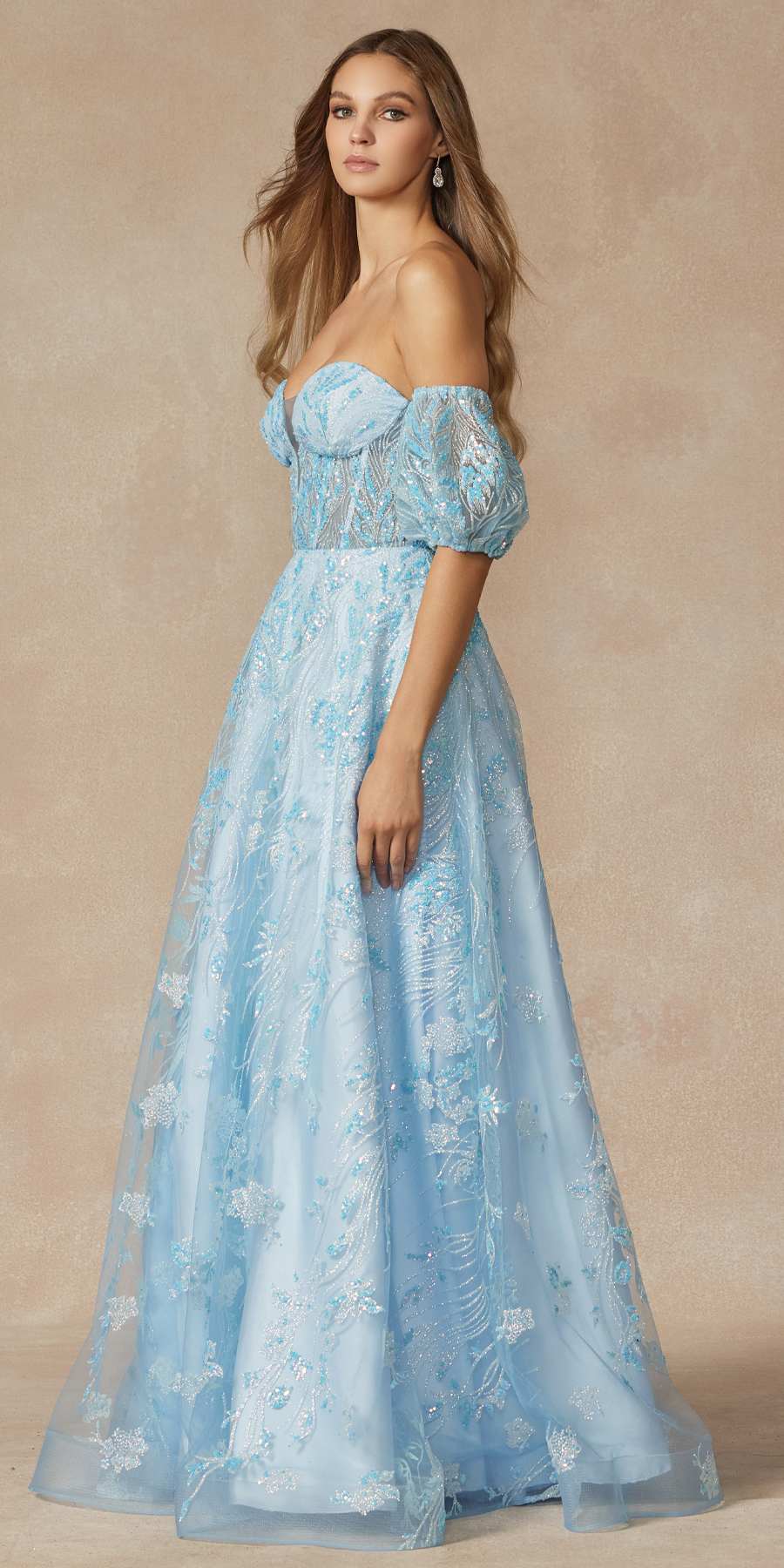 Sky blue strapless sequin tulle ballgown with fitted bodice, puff sleeves, and flowing skirt