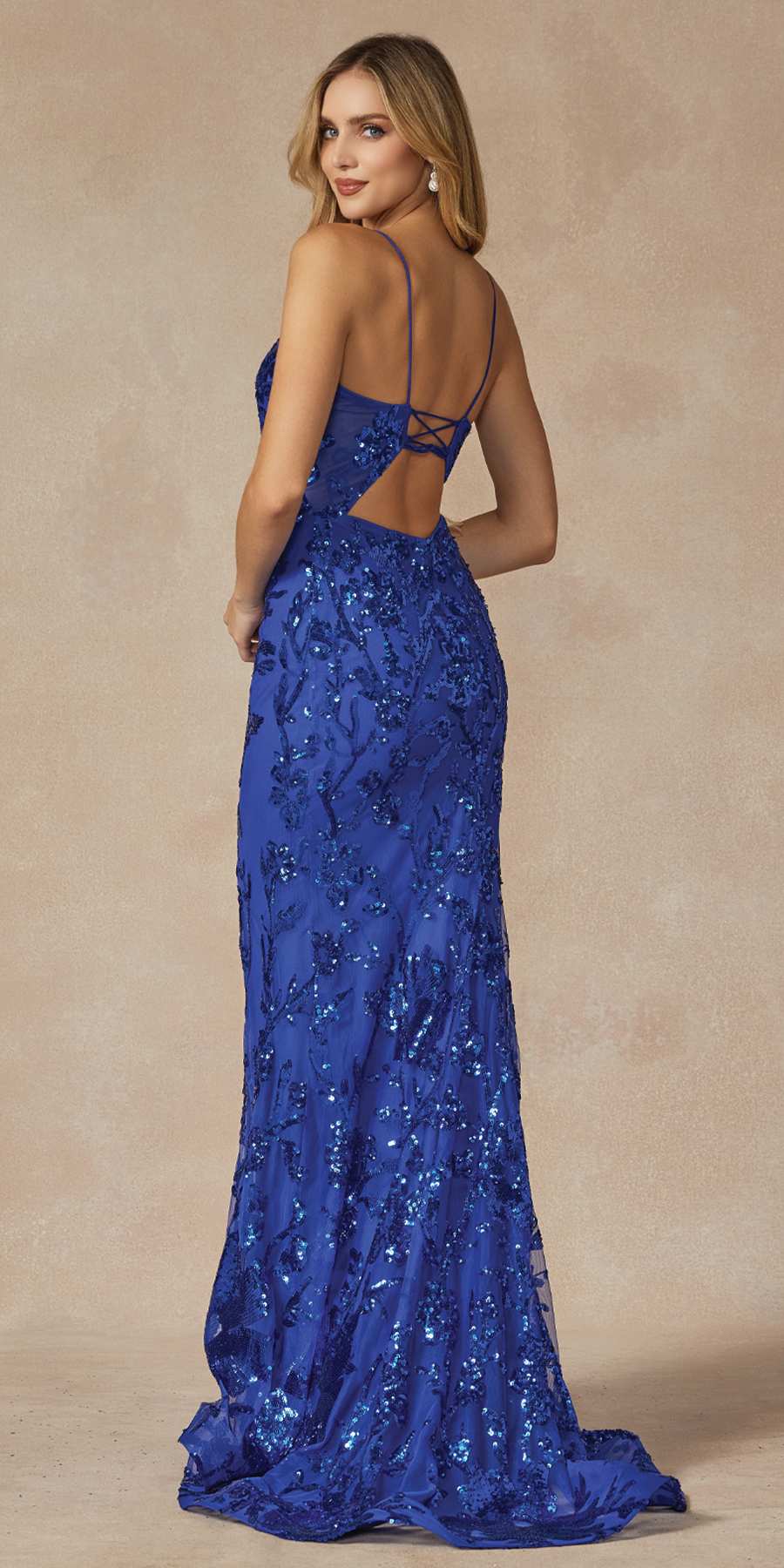 Royal blue sequin fitted prom gown with low open back and mermaid skirt
