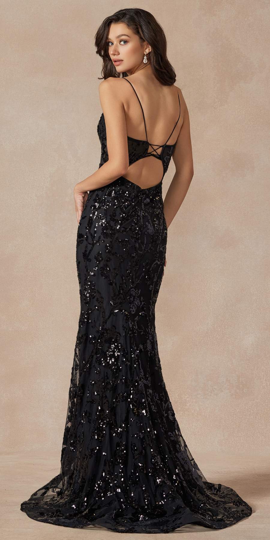 Black fitted prom gown with open back crisscross straps and allover sequin lace
