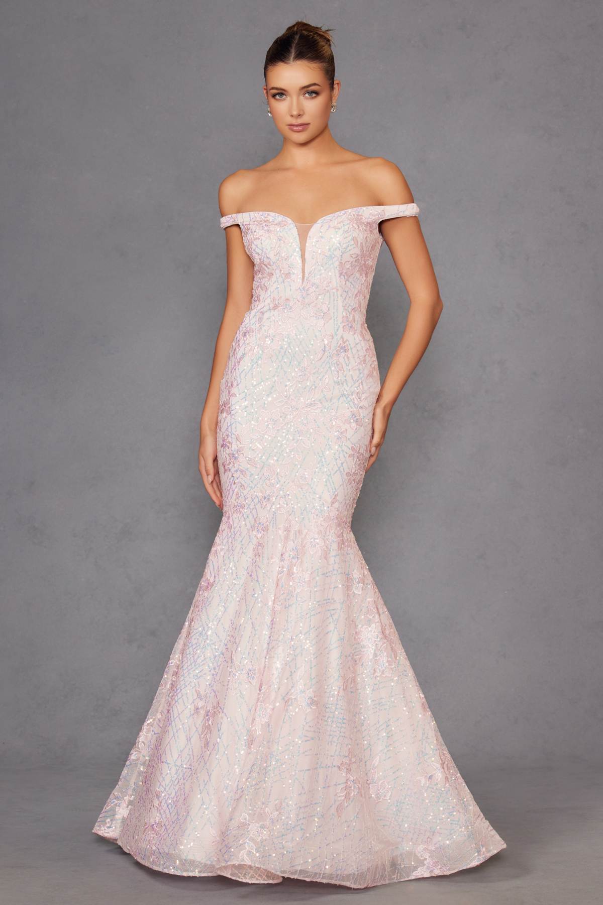 Blush mermaid gown with off-shoulder neckline and illusion bodice, sparkle texture.
