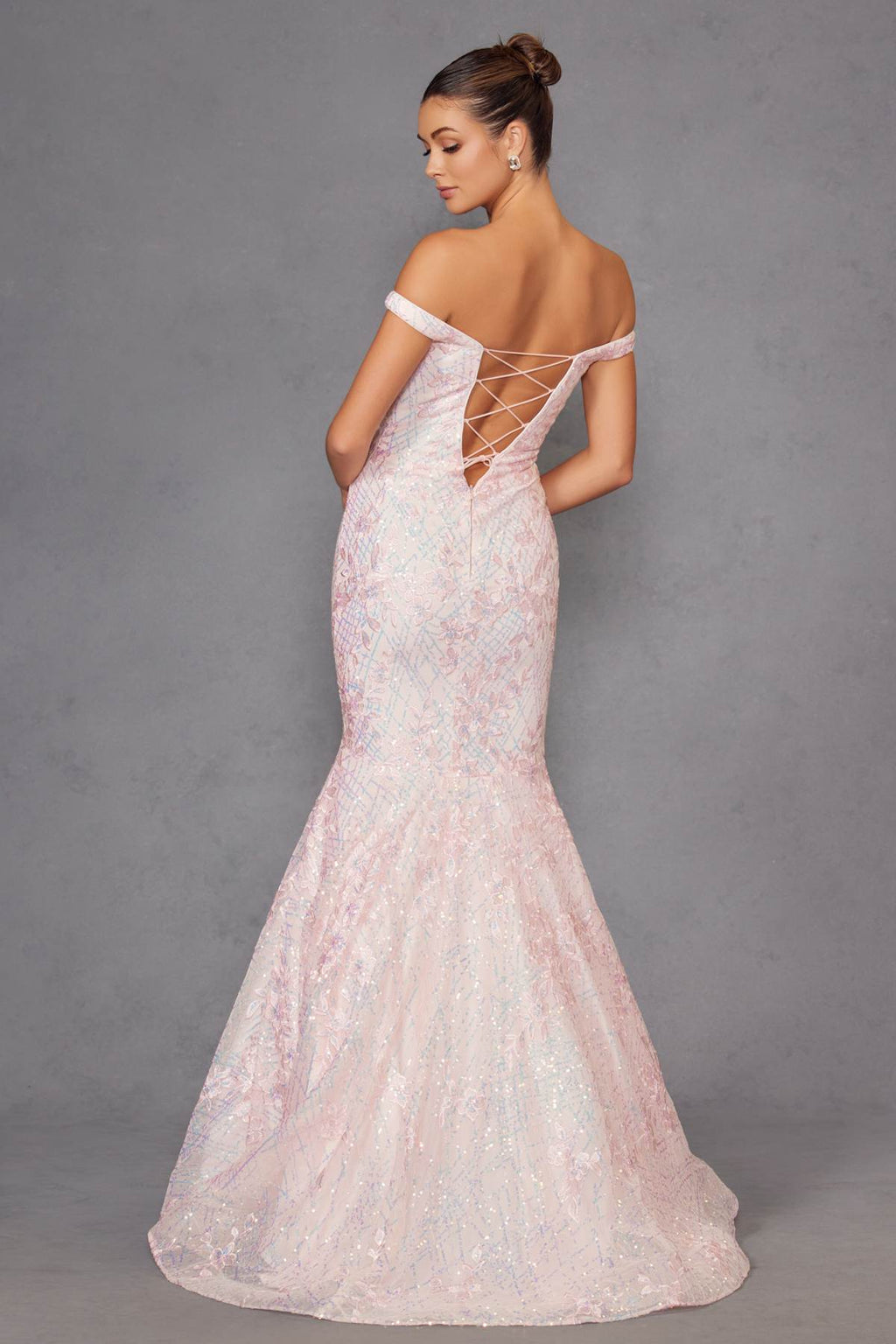 Blush mermaid gown back view with lace-up straps and off-shoulder sleeves, sparkly.