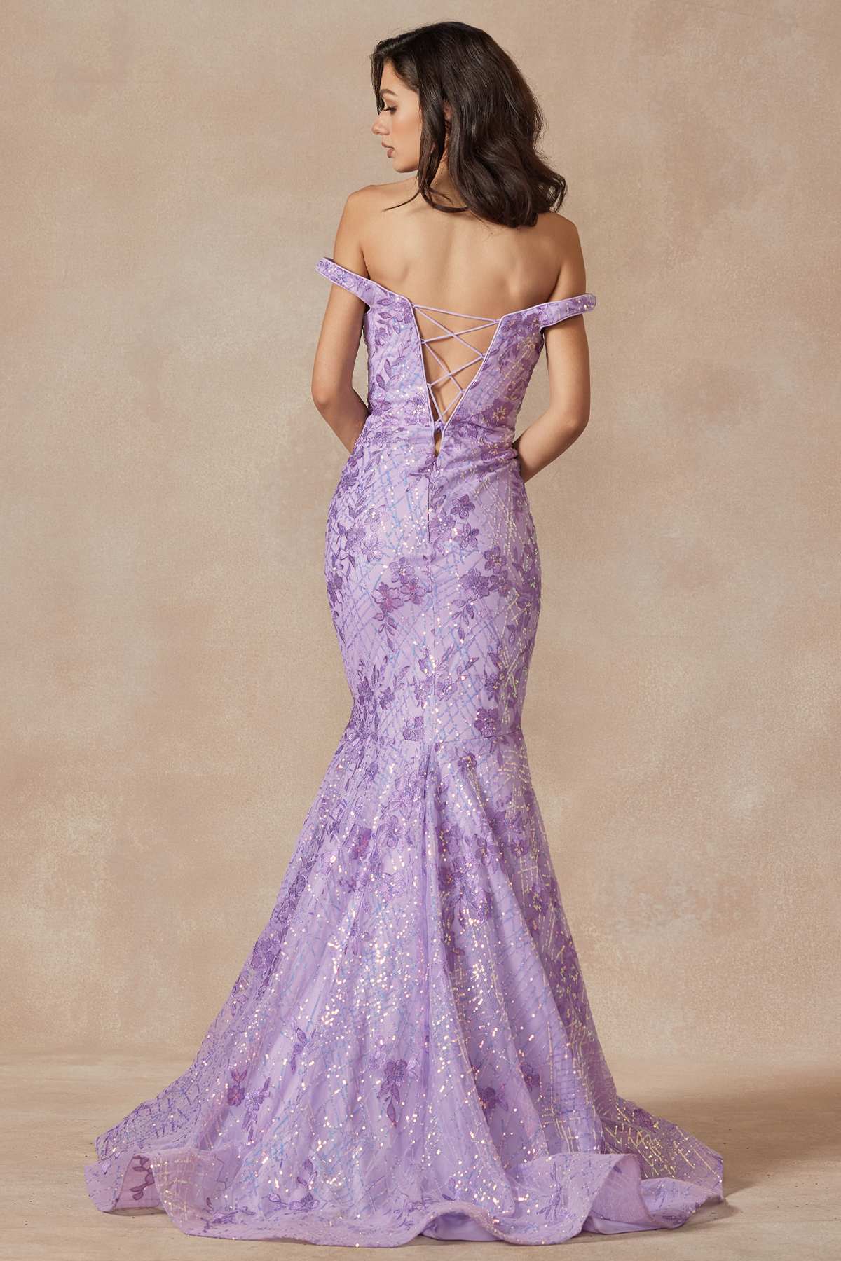 Lilac mermaid gown back view with crisscross straps and off-shoulder sleeves, sparkly.