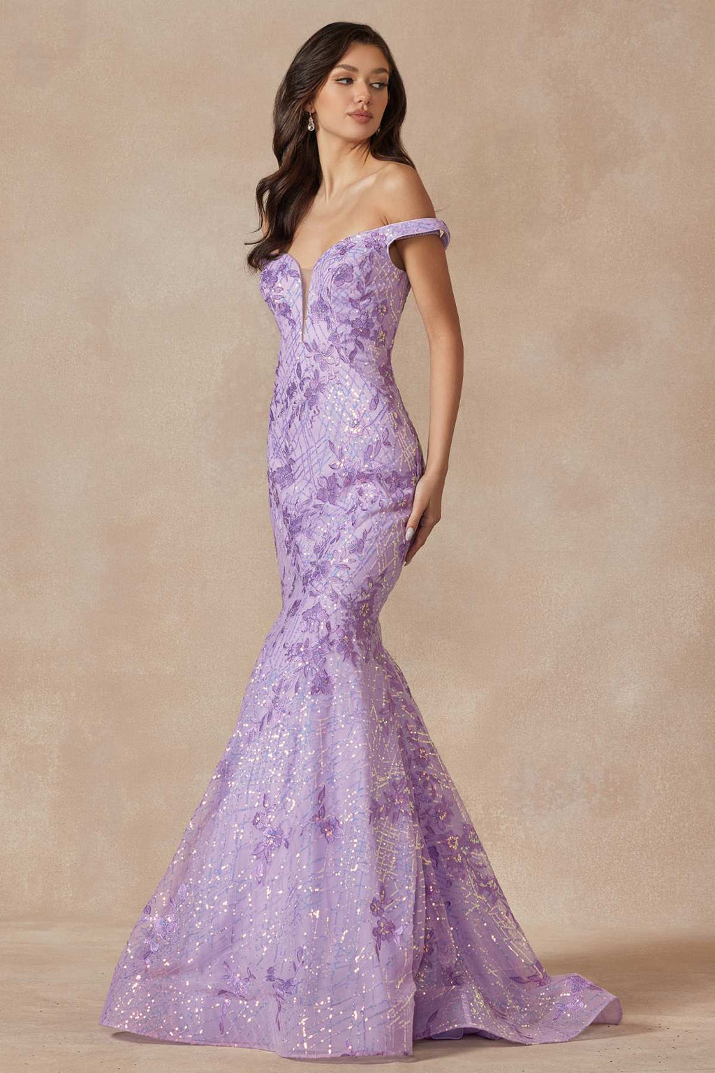 Lilac mermaid gown with off-shoulder neckline and fitted sparkle fabric, full length.