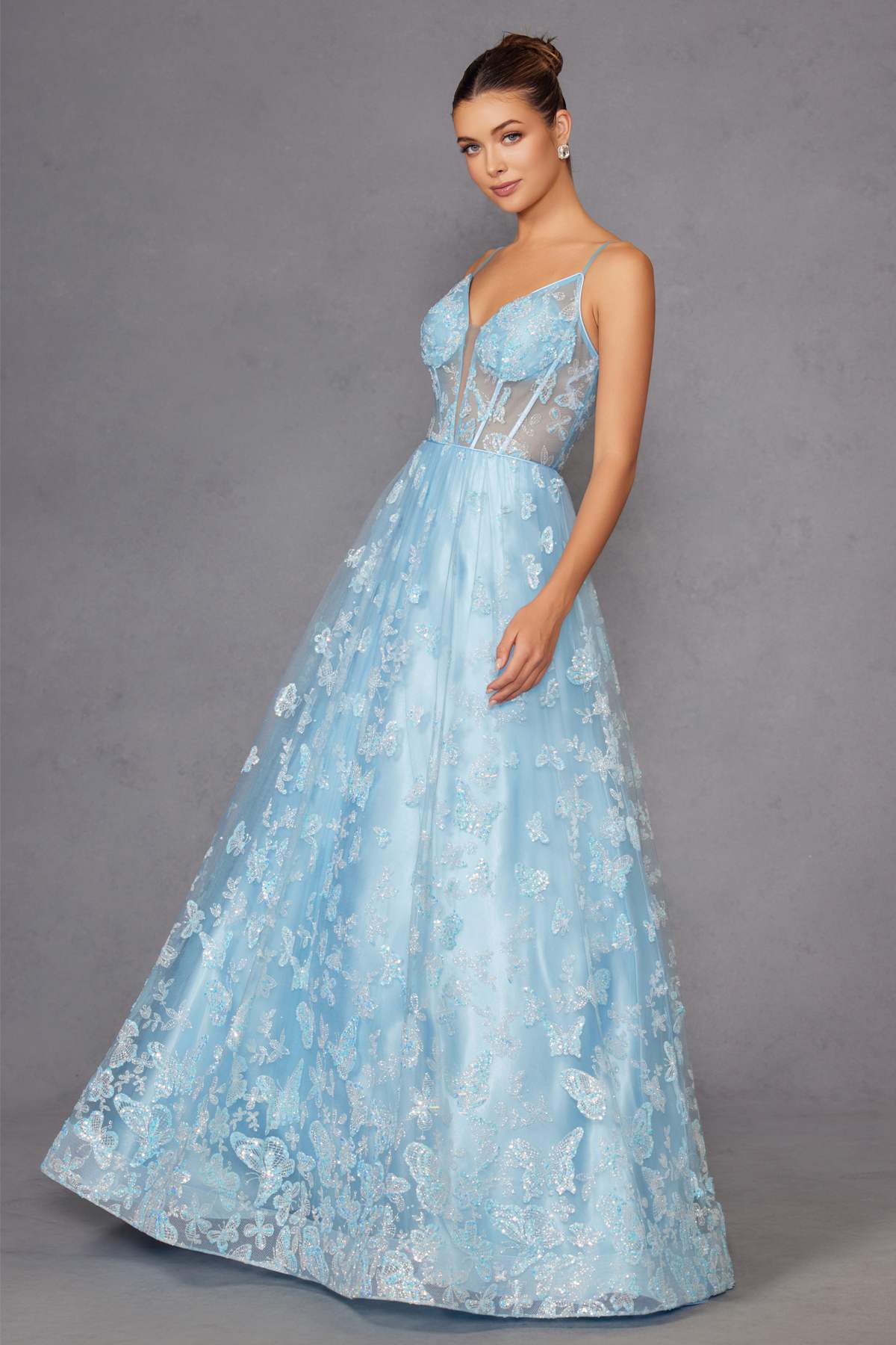 Ice blue long A-line gown with corset top, thin straps, glitter embroidered skirt