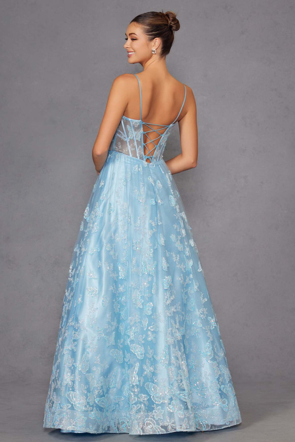 Ice blue long A-line gown with crisscross open back, spaghetti straps, glitter embroidery