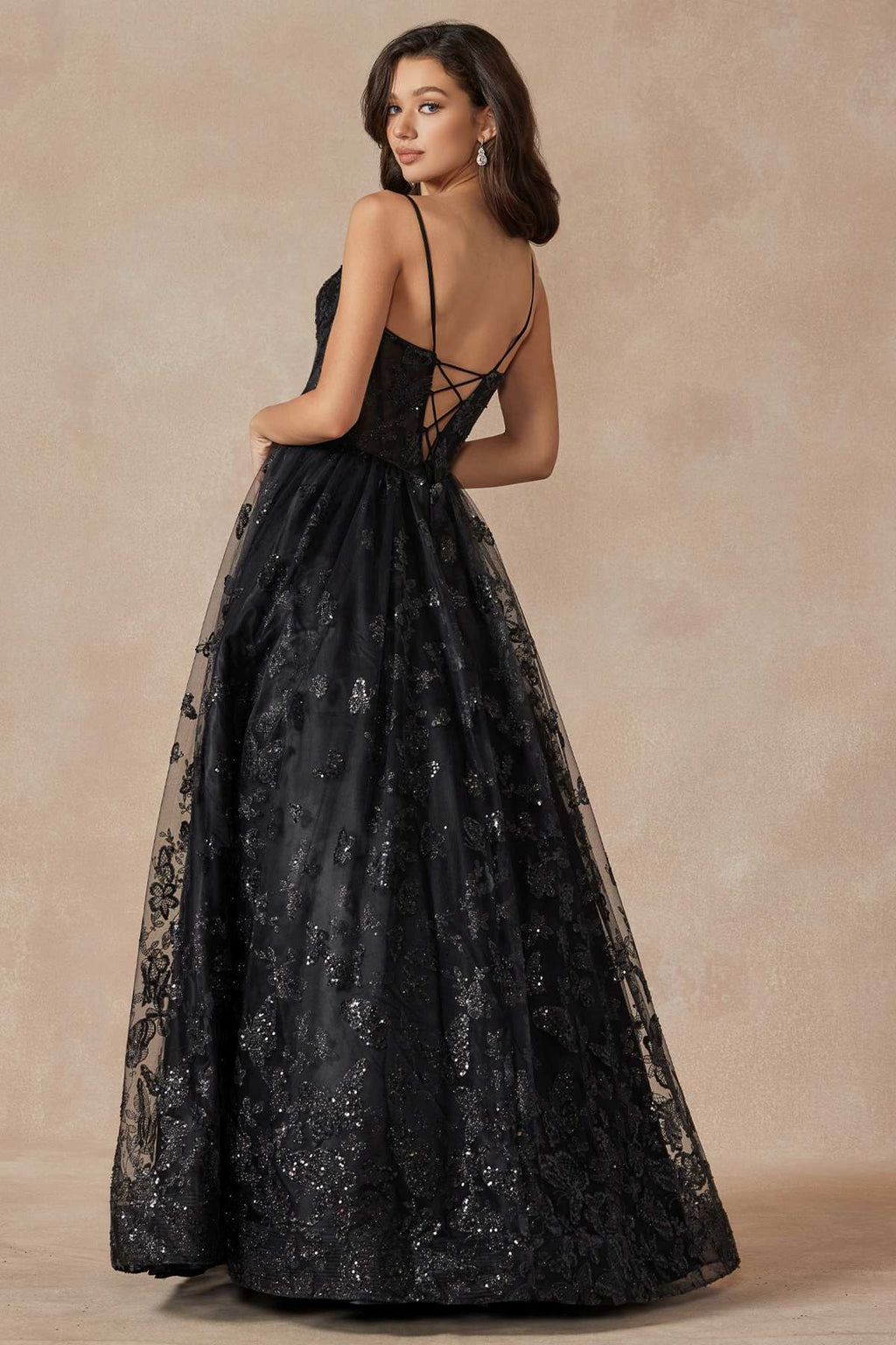 Black long A-line gown with crisscross open back, spaghetti straps, glitter embroidery
