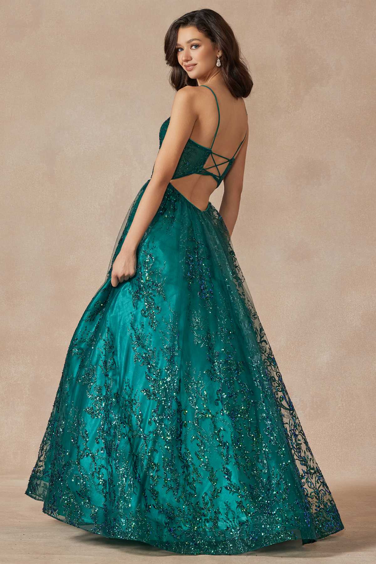 Emerald green corset-style ball gown with crisscross back and glitter lace skirt