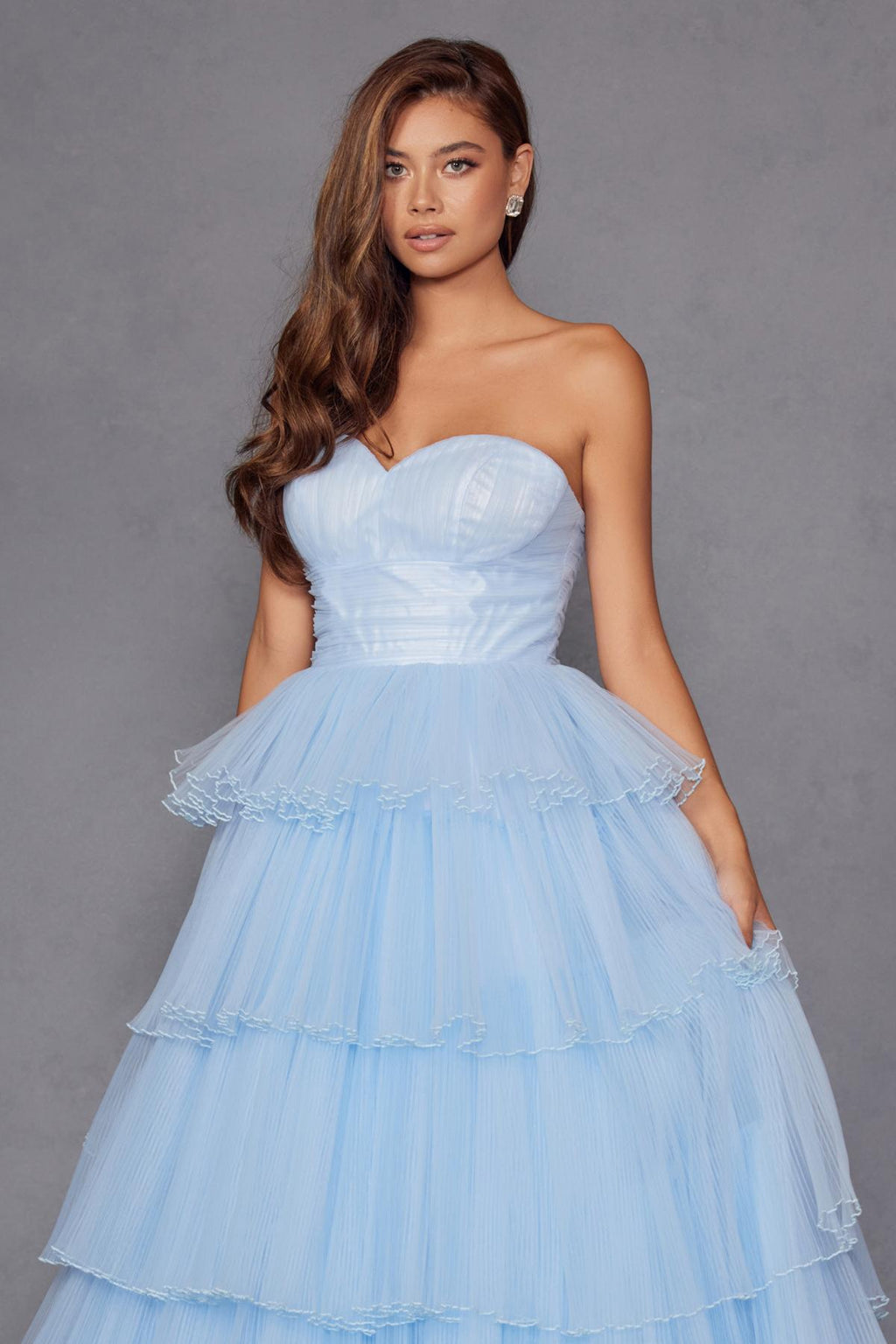 Ice blue strapless gown with pleated sweetheart bodice and tiered ruffles