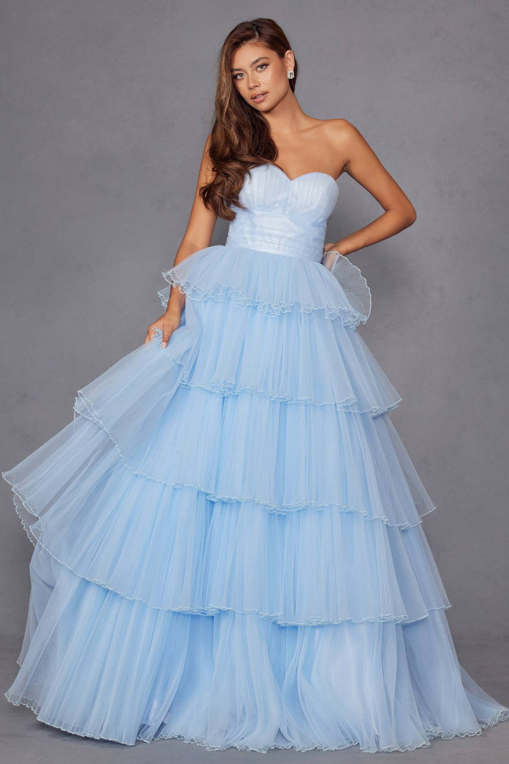 Ice blue strapless tiered ruffle tulle A-line gown with pleated bodice