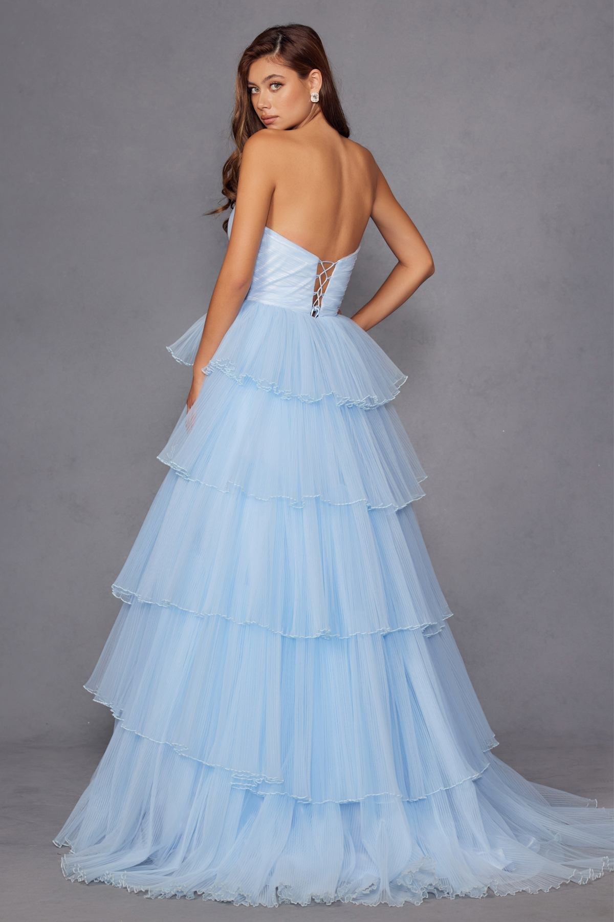 Ice blue strapless A-line gown with layered ruffle skirt and boned bodice