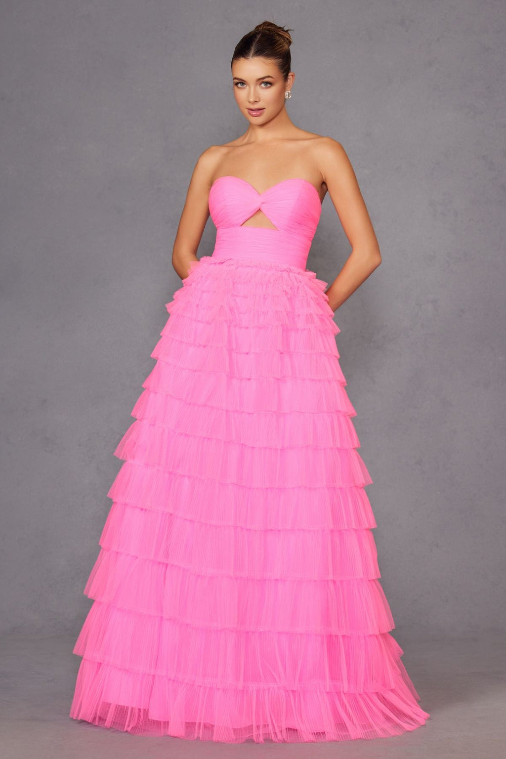 Neon pink strapless tiered tulle A-line gown with bow-tied bodice