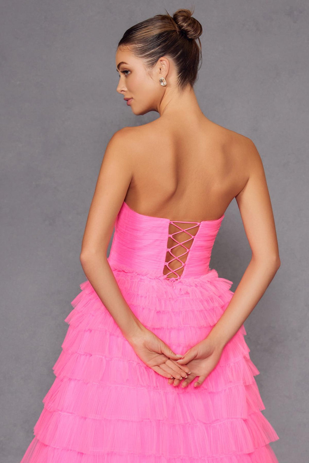Neon pink tiered tulle A-line gown with crisscross lace-up open back