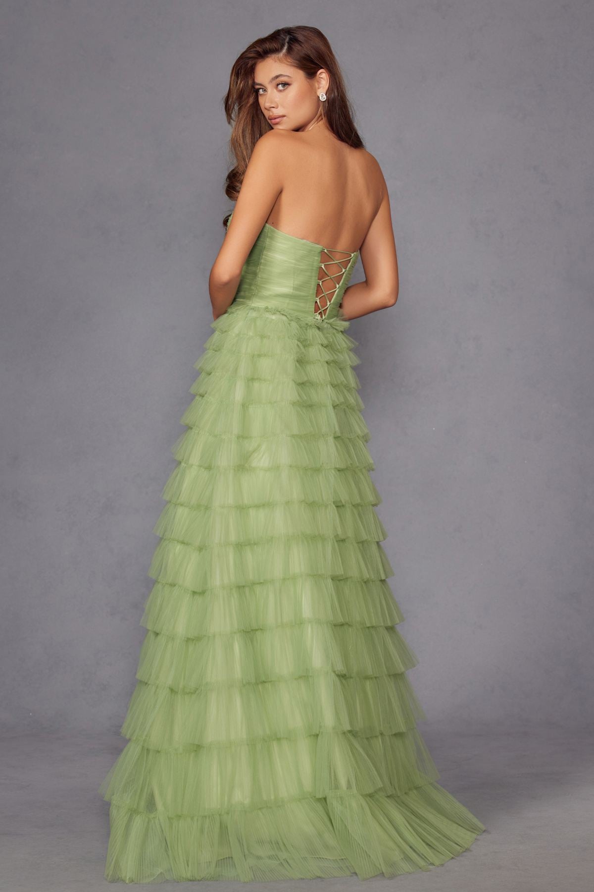 Sage green tiered tulle A-line gown with open back and crisscross detail