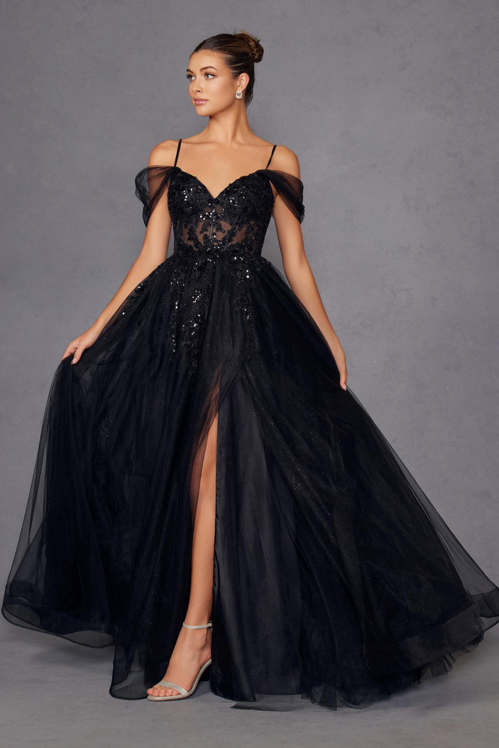 Black cold-shoulder sweetheart corset bodice A-line gown with sparkle tulle and thigh slit.