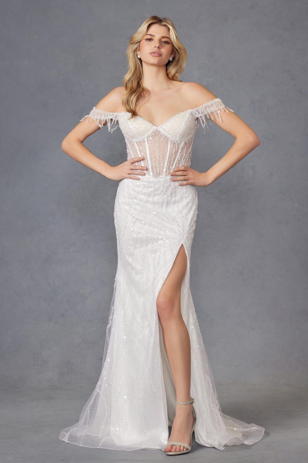 Off-white long off-shoulder fitted wedding gown with fringe sleeves and side leg slit