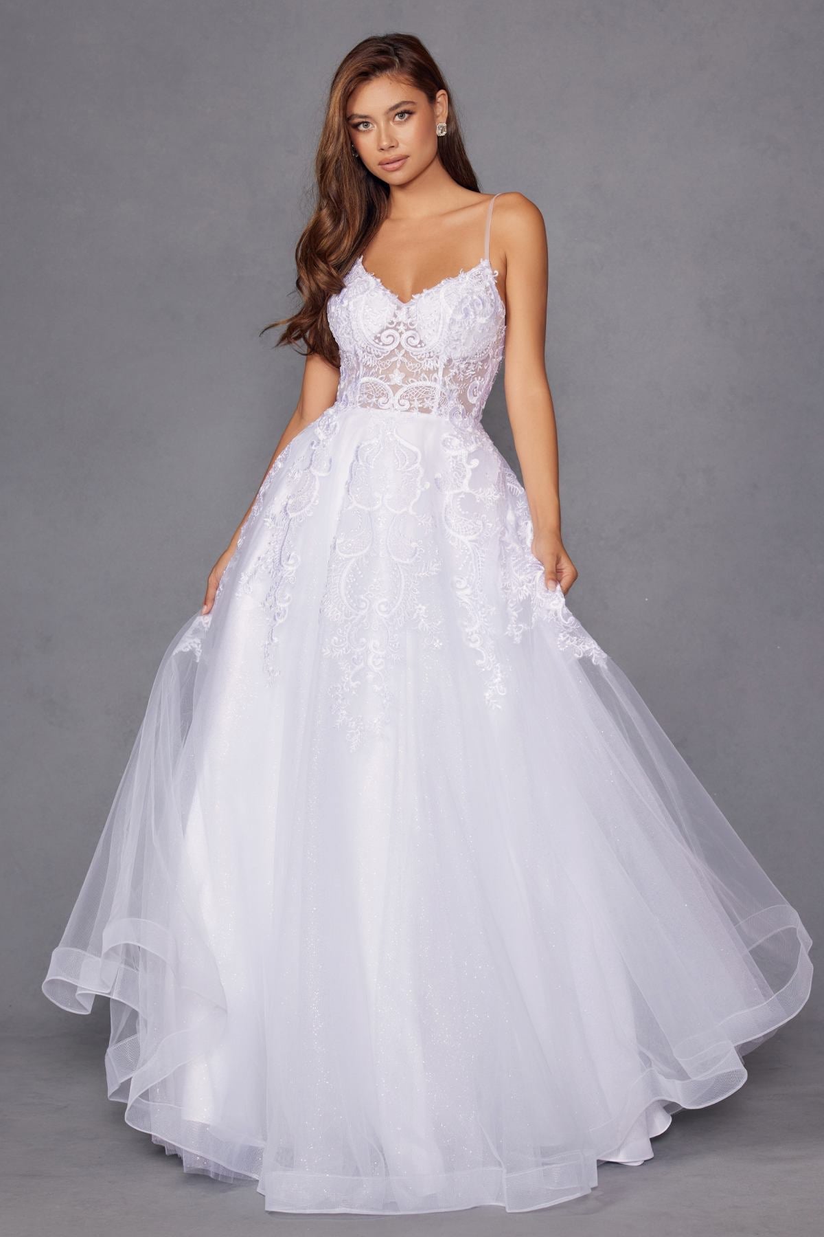 White lace wedding ball gown with spaghetti straps and full tulle skirt